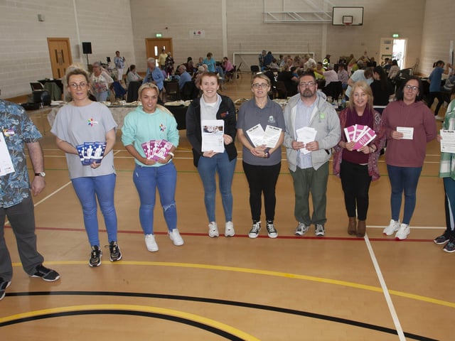 Organisers and facilitators pictured at Wednesdayâ€TMs Creggan 75th Reconnecting Lunch at Bishopâ€TMs Field Sports Hall. The event was held as part of the â€ ̃Communities in Transitionâ€TM project. From left, Glen Foley, Creggan Library, Michelle McLaren, Pink Ladies, Edelle Moore, Pink Ladies, Julie White, Old Library Trust, Tina Burke, Triax Neighbourhood Management Team, Colm Barton, TNMT, Cathy Sweeney, Dove House, Kellie McBrearty, CNP and Kyra Reynolds, TNMT.