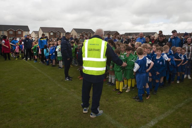 Teams lined up to pick up their medals after Sundayâ€TMs soccer tournament at Oakland Park in Creggan, Derry.