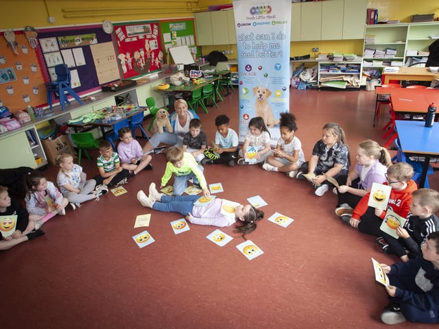 â€ ̃Fresh Little Mindsâ€TM facilitator Mary Fitzpatrick working during the workshops with some of the children at Holy Child PS.