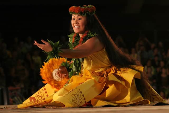 a performance at the annual Merrie Monarch Festival in Hilo, Hawaii - the festival is named after David Kalākaua, the last king and penultimate  monarch of Hawaii who appointed Campbell to his House of Nobles.