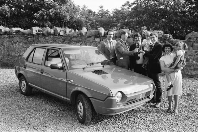 A Buncrana Youth Club draw for a Fiat Ritmo car was won by two-year-old Jonathan Lynch whose name had been entered by his father Daniel. Mr. P.J. Hallinan, chair of the Youth Club, is pictured presenting the keys to Jonathan being held by his father, with, on right, Mrs. Sheila Lynch with daughter Brenda and centre, Mr. Bernard Griffin, the ‘Mayor of Buncrana’ and, on left, Mr. Danny Kelly, Farren’s Garage, Buncrana, who supplied the car.