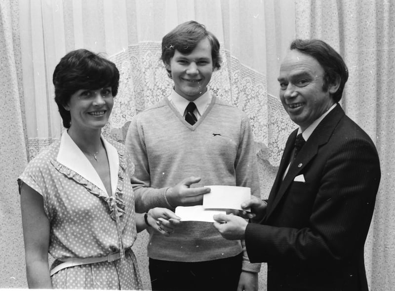 Mr. Gerry Smyth, on right, president Derry Lions Club, receiving cheques towards Lions Club charities totalling £350 from Bernie Mount and Tony McGilloway who received sponsorship for their recent participation in the Foyle Festival Marathon.