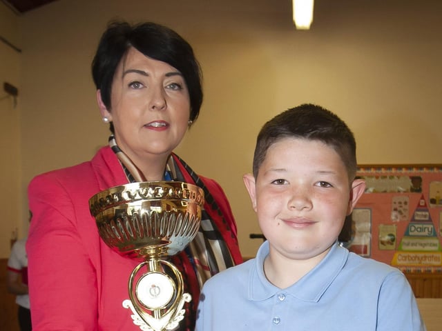Jamie Long receiving the Soccer Player of the Year award from Ms. Duggan.