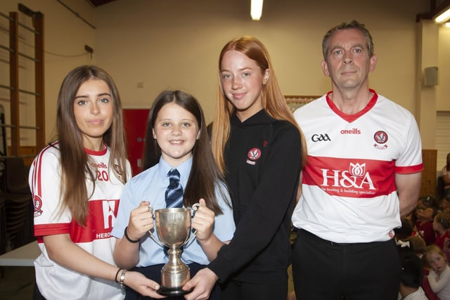 Anna Meehan receiving the Gaelic Player of the Year award from Annie Duffy and Rosa Gallagher, two All-Ireland winning past pupils. On right is Mr. Francis Mallon, Gaelic Coach/Teacher.