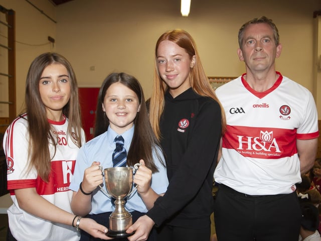 Anna Meehan receiving the Gaelic Player of the Year award from Annie Duffy and Rosa Gallagher, two All-Ireland winning past pupils. On right is Mr. Francis Mallon, Gaelic Coach/Teacher.