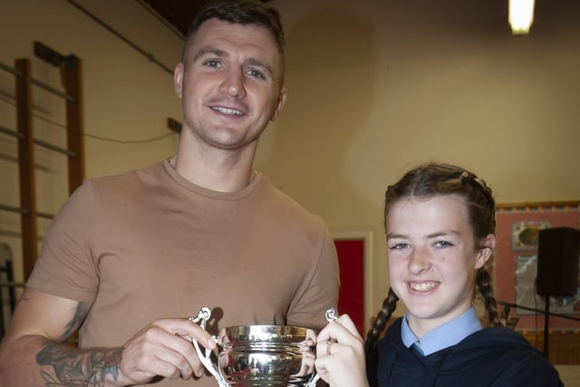 Quinn Doherty Buchannan receiving the Athlete of the Year award from Conor Coyle.