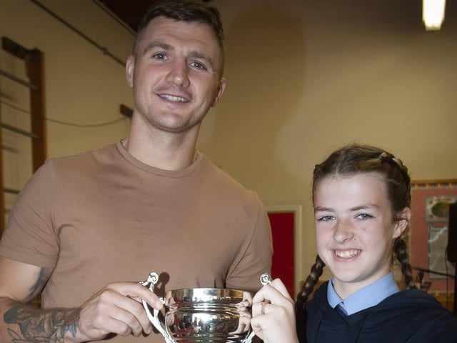 Quinn Doherty Buchannan receiving the Athlete of the Year award from Conor Coyle.