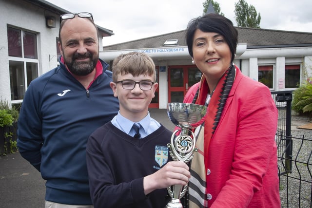 Callum Breen receiving the award for most improved in sporting achievement from Mr. Feargal Friel, Vice Principal and Ms. Teresa Duggan, Principal.