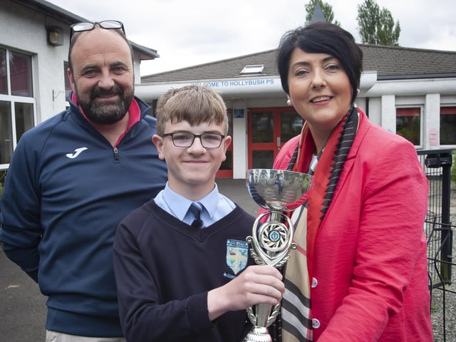 Callum Breen receiving the award for most improved in sporting achievement from Mr. Feargal Friel, Vice Principal and Ms. Teresa Duggan, Principal.