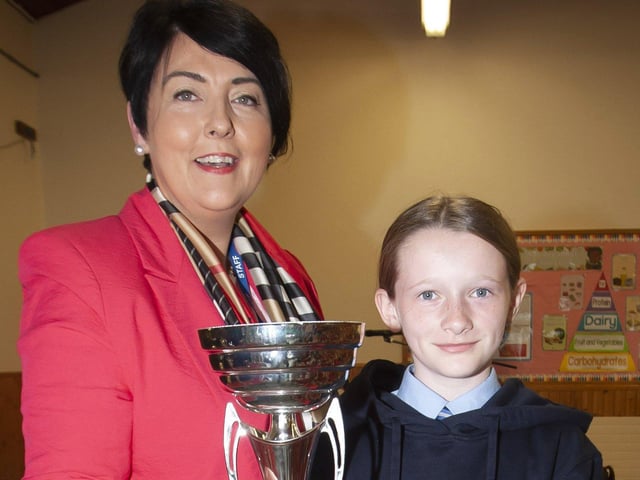 Ana Kirby receiving the Netball Player of the Year award from Ms. Duggan, Principal.