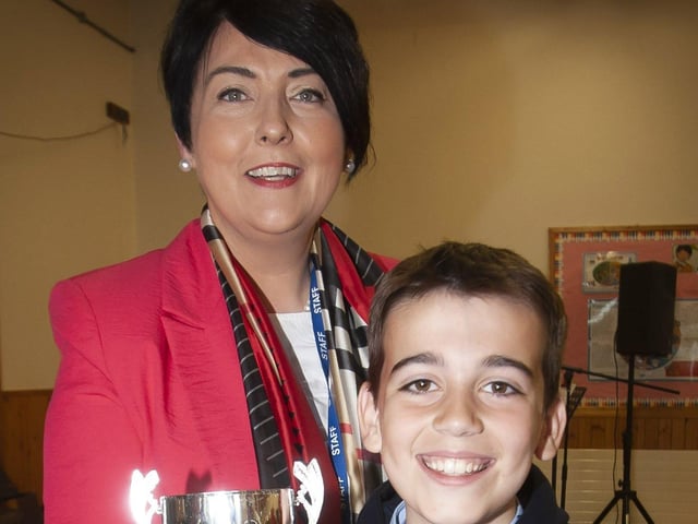 Peter Strawbridge receiving the Swimmer of the Year award from Ms. Duggan.