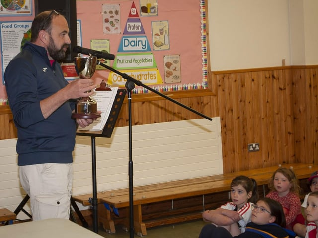 Mr Feargal Friel, Vice Principal, introduces the inaugural Carmel Dunn Award for environmental commitment during last week's prizegiving at Hollybush PS.