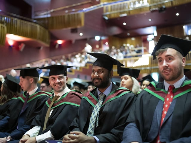 Graduates at the Millennium Forum. (Photo: Nigel mcDowell/Ulster University)