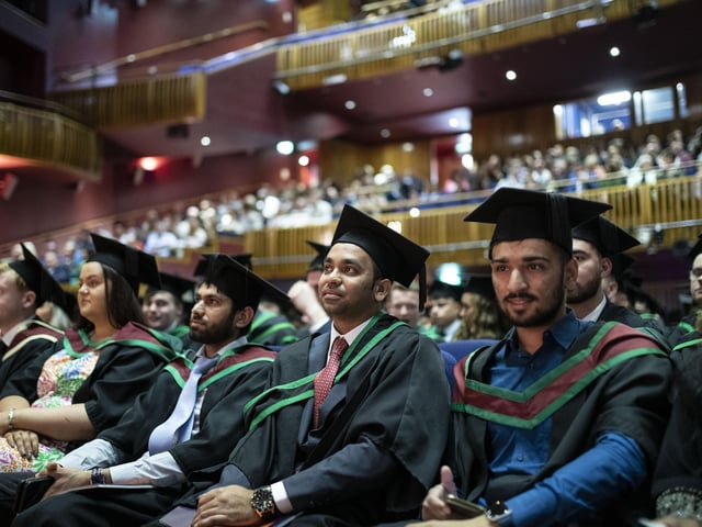 Graduates at the Millennium Forum. (Photo: Nigel mcDowell/Ulster University)