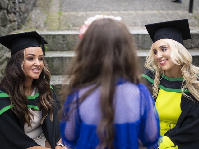Siobhan McKenna and Hannah Younger, Ulster University Graduations - Millennium Forum.  (Photo: Nigel mcDowell/Ulster University)