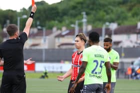 Matty Smith is shown a straight red after a confrontation with Riga's Ngonda in the second half of the Europa Conference League tie at Brandywell. Photo by Kevin Moore.