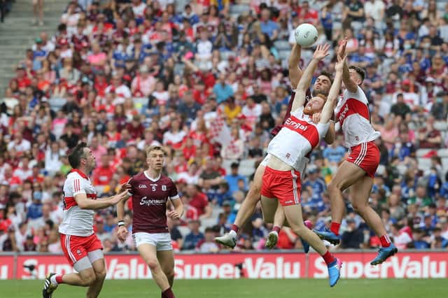 Conor Glass loses out in this midfield battle during the All Ireland SFC semi-final against Galway at Croke Park. Photograph by Margaret McLaughlin.