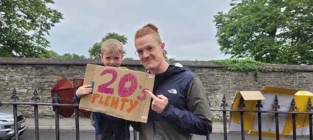 '20's plenty', says Darragh and Micheal at the crossing to Brooke Park at Creggan Hill.