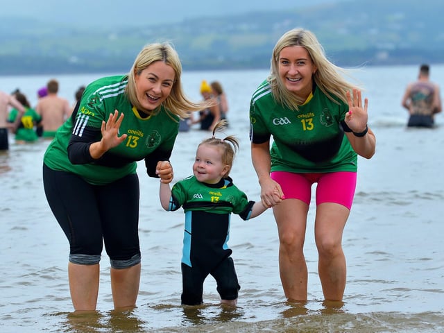 Young Kate McVeigh pictured with Denise ONeill and Maria Kelly at the joint fundraising event Cold Water Weekend in memory of Aodhán ODonnell with Waves for Mental Health held at Ludden Beach on Saturday and Sunday morning last. Photograph: George Sweeney. DER2228GS 005
