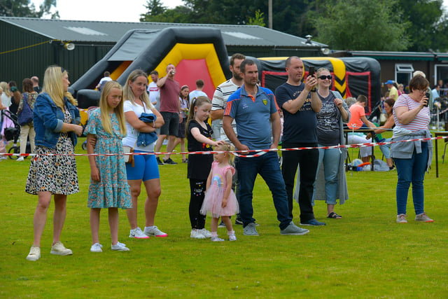Families watch the children’s egg and spoon race at the Muff Family Funday held on Sunday afternoon last. Photograph: George Sweeney.  DER2228GS – 028
