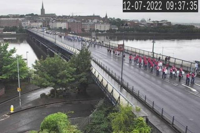 The 'Twelfth' demonstration makes its way across the Craigavon Bridge this morning.
