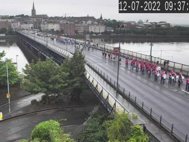 The 'Twelfth' demonstration makes its way across the Craigavon Bridge this morning.