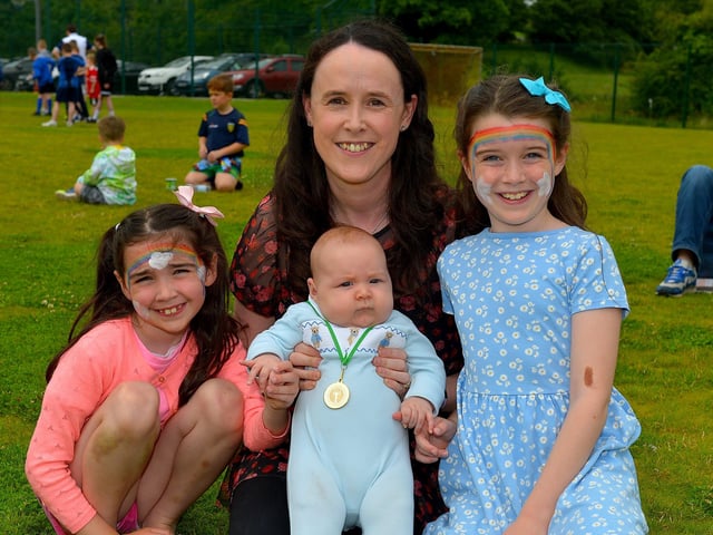 Three month old Alex Lynch, pictured with sisters Amie and Katie and mum Aileen, was awarded first prize in the Bonny Baby 0-6 month’s old competition at the Muff Family Funday held on Sunday afternoon last. Photograph: George Sweeney. DER2228GS – 009