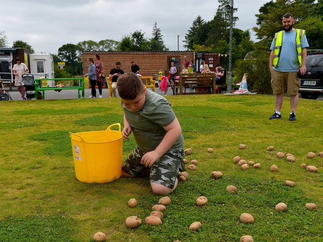 Aiden McCallion taking part in the spud collecting competition at the Muff Family Funday held on Sunday afternoon last. Photograph: George Sweeney. DER2228GS – 011