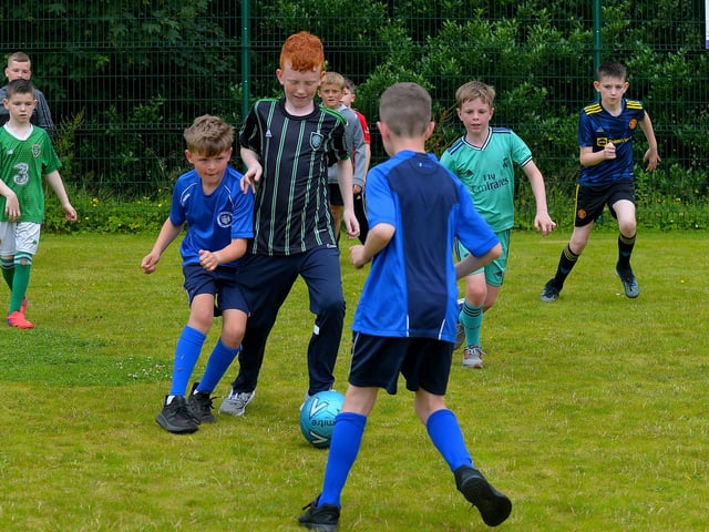 Soccer competition underway at the Muff Family Funday held on Sunday afternoon last. Photograph: George Sweeney. DER2228GS – 019