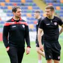 Derry City boss Ruaidhri Higgins pictured with Patrick McEleney during a training session at Riga FC's stadium on Wednesday afternoon. Photograph by Kevin Moore.