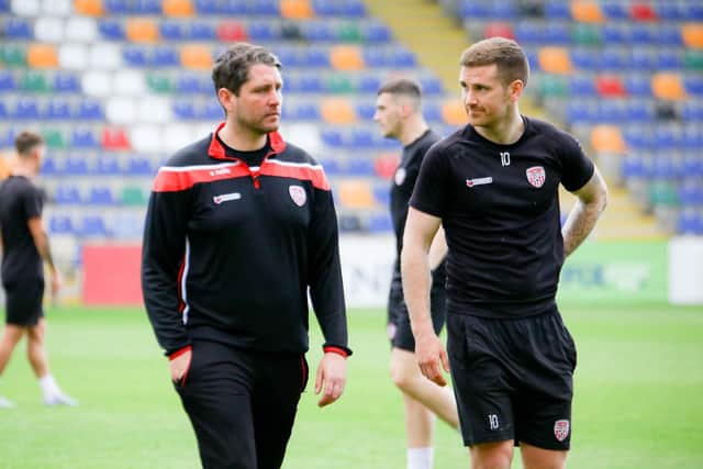 Derry City boss Ruaidhri Higgins pictured with Patrick McEleney during a training session at Riga FC's stadium on Wednesday afternoon. Photograph by Kevin Moore.