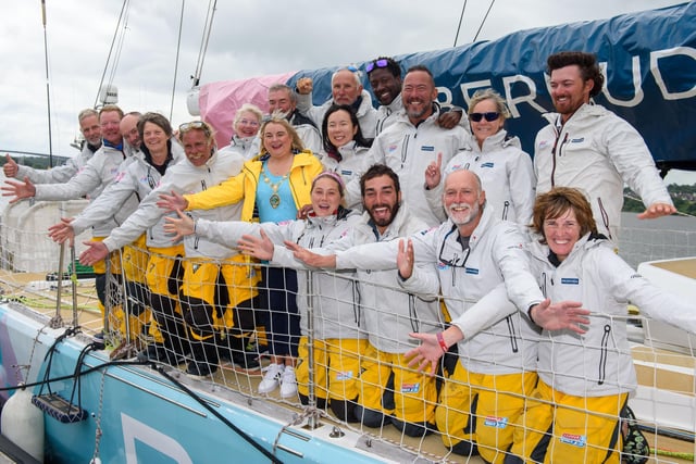 Derry City and Strabane District Council Mayor Councillor Sandra Duffy celebrates with the crew of Bermuda as they came first in race 14 in The Clipper Round the World Yacht Race arrives on the River Foyle in Derry-Londonderry Northern Ireland after completing an epic race across the Atlantic from New York. Picture  Martin McKeown. 13.07.22