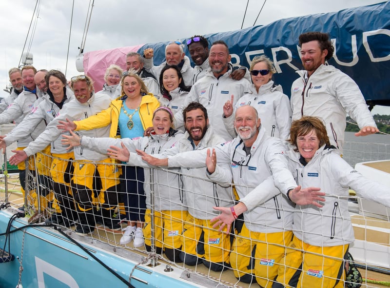 Derry City and Strabane District Council Mayor Councillor Sandra Duffy celebrates with the crew of Bermuda as they came first in race 14 in The Clipper Round the World Yacht Race arrives on the River Foyle in Derry-Londonderry Northern Ireland after completing an epic race across the Atlantic from New York. Picture Martin McKeown. 13.07.22