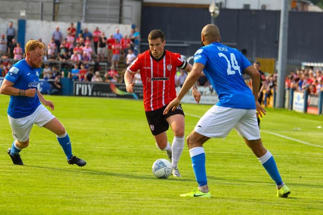 Patrick McEleney takes on Finn Harps players Ethan Boyle and Ryan Connolly during the first half of the derby clash in Ballybofey. Photo by Kevin Moore.