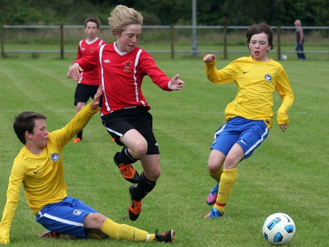 Maiden City Academy’s Michael Brown, breaking through the Stonebridge defence during action in their Foyle cup under 13 game at Newbuildings. INLS 1230-522MT.