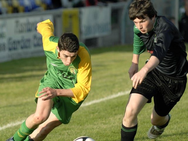 Donegal Schoolboys winger Conor Doherty races past Draperstown Celtic defender Odhran McGuigan during their Under-15's final at the Riverside Stadium. 2407JM11