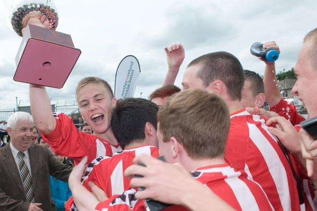Captain Joshua Tracey with the Derry and District Youth League team as they celebrate after winning the Under 16 Foyle Cup against Inishowen Youth League at the Brandywell Stadium. Picture Martin McKeown. Inpresspics.com. 21.07.12