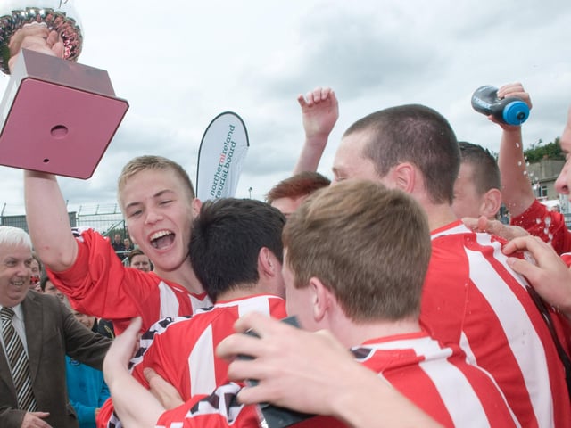 Captain Joshua Tracey with the Derry and District Youth League team as they celebrate after winning the Under 16 Foyle Cup against Inishowen Youth League at the Brandywell Stadium. Picture Martin McKeown. Inpresspics.com. 21.07.12