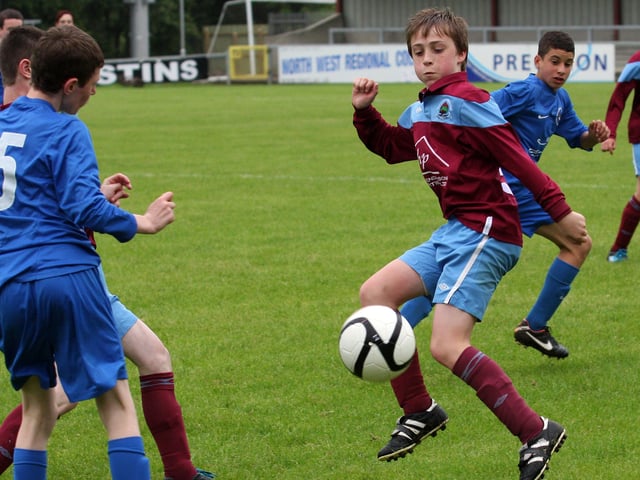 Institute’s Callum O’Neill, attempts to bring the ball under control during the action against Ballinamallard, in their Foyle cup under 14 game at the Riverside Stadium. INLS 1230-523MT.