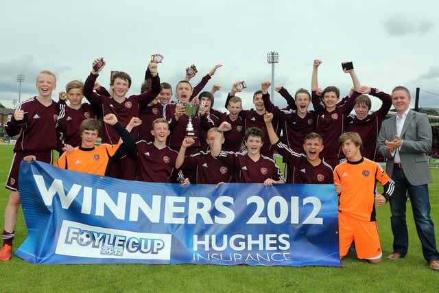 ©/Lorcan Doherty Photography -  July 21th 2012. 

Hughes Insurance Foyle Cup U-14 Cup Final. Hearts V St. Oliver Plunkett FC (Belfast). Brian McDowell, Head of Sales and Marketing at Hughes Insurance, with the victorious Hearts team.

Photo Credit Lorcan Doherty Photography