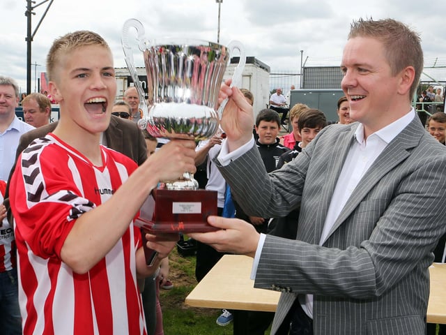 ©/Lorcan Doherty Photography - July 20th 2012.
Hughes Insurance Foyle Cup U-16 Cup Final. Derry & District Youth FA v Inishowen Youth League. Brian McDowell, Head of Sales and Marketing at Hughes Insurance, presenting the Hughes Insurance U-16 Foyle Cup to Joshua Tracey, captain, Derry and District, who defeated Inishowen Youth League in the final. Brian McDowell of Hughes Insurance stated: "The Hughes Insurance Foyle Cup is a tournament Derry can be proud of. Hughes Insurance is incredibly proud to be associated with a prestigious tournament that is clearly the premier youth competition in Europe. Everyone involved with the Foyle Cup - from the organisers to the participating teams should take credit for what has been a truly world class football tournament."
Photo Credit Lorcan Doherty Photography
