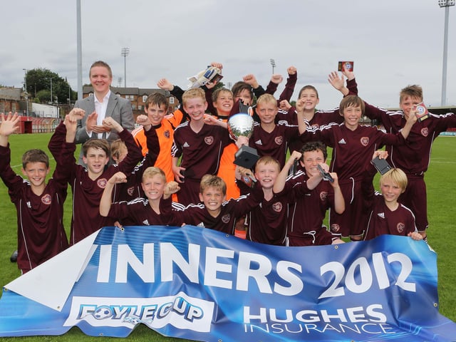 ©/Lorcan Doherty Photography -  July 21th 2012. Hughes Insurance Foyle Cup U-12 Final. Hearts V NECSL (Meath).Hearts celebrate their 5-1 victory over NECSL. Included is Brian McDowell, Head of Sales and Marketing at Hughes Insurance. Brian McDowell of Hughes Insurance stated: "The Hughes Insurance Foyle Cup is a tournament Derry can be proud of.  Hughes Insurance is incredibly proud to be associated with a prestigious tournament that is clearly the premier youth competition in Europe.  Everyone involved with the Foyle Cup - from the organisers to the participating teams should take credit for what has been a truly world class football tournament."Photo Credit Lorcan Doherty Photography