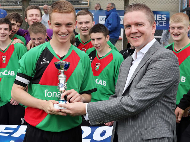 ©/Lorcan Doherty Photography - July 20th 2012.
Hughes Insurance Foyle Cup U-16 Pate Final. Glentoran V Strabane Athletic.
Brian McDowell, Head of Sales and Marketing at Hughes Insurance, presenting the Hughes Insurance U-16 Foyle Plate to Ryan Cochrane, captain, Glentoran, who defeated Strabane Athletic in the final. Brian McDowell of Hughes Insurance stated: “The Hughes Insurance Foyle Cup is a tournament Derry can be proud of. Hughes Insurance is incredibly proud to be associated with a prestigious tournament that is clearly the premier youth competition in Europe. Everyone involved with the Foyle Cup – from the organisers to the participating teams should take credit for what has been a truly world class football tournament.”
Photo Credit Lorcan Doherty Photography
