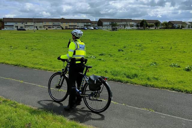A police officer on patrol in the Galliagh area.
