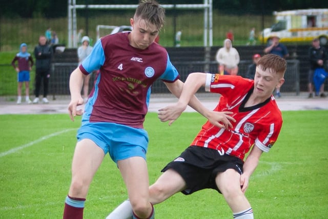A Tummery player holds off a Derry City player, during their O'Neills Foyle Cup game. Picture by Jim McCafferty