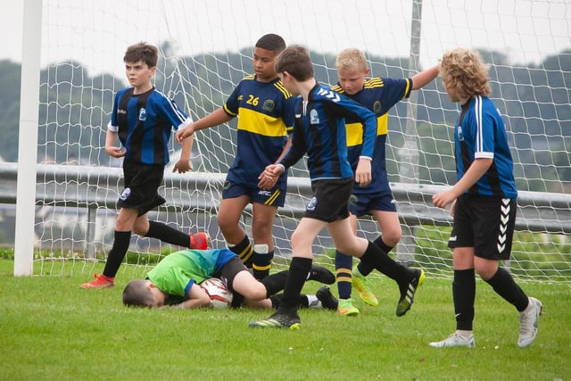 Goalkeeper holds on to the ball during Don Boscos versus Raphoe U12 O'Neills Foyle Cup game. Picture by Jim McCafferty
