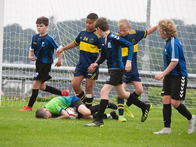 Goalkeeper holds on to the ball during Don Boscos versus Raphoe U12 O'Neills Foyle Cup game. Picture by Jim McCafferty