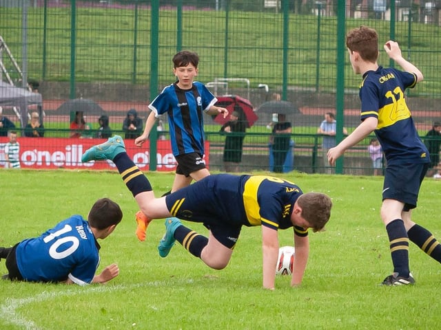 Midfield action from Don Boscos versus Raphoe U12 O'Neills Foyle Cup game. Picture by Jim McCafferty