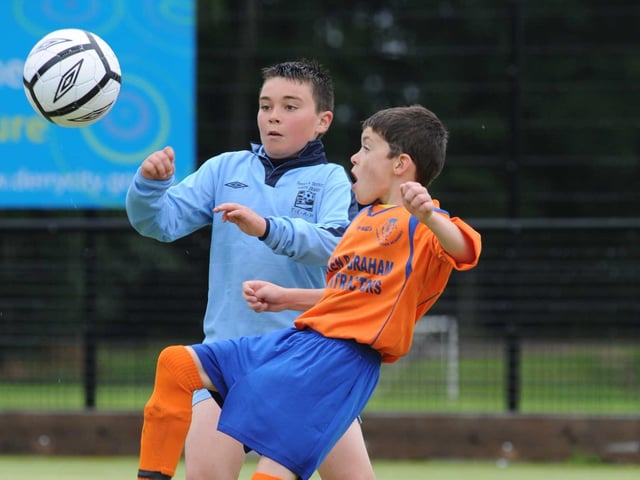 Close sontrol from Luke McAteer, Mulroy Academy Under 10 player in the Foyle Cup cpmpetition held last eweek in St. Columbs Park Derry . (photo Paddy Gallagher).