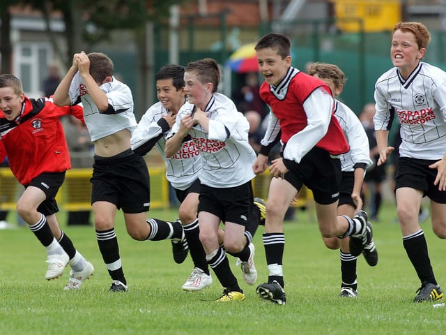 y©/Presseye.com - 24th July 2010. Press Eye Ltd - Northern Ireland. Foyle Cup 2010. U-12 Plate Final. Arklow Town FC V Downpatrick Youth League. Downpatrick players run from the centre circle fater the penalty shoot out victory.
Mandatory Credit Photo Lorcan Doherty / Presseye.com